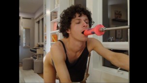 cute femme boy gives flirty blowjob to fucking machine