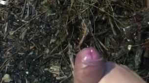 My phimosis penis masturbation by hand in the rainy garden. The tip of the penis is red