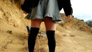 Transgender Honoka can't resist peeing in the depths of a decaying mountain.