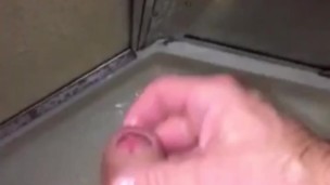 Horny in the shower, cumshot landed on the shower door glass, as it was running down, I licked it up