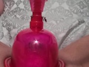 Pumping up pussy and clit with pussy pump making her swell 