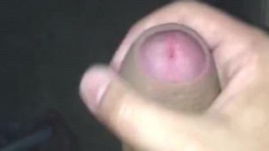 Uncut dude jerks off and cums all over wall