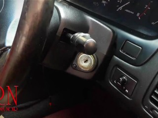 A lady masturbates in a car in a parking lot Teasing a clit with a dildo