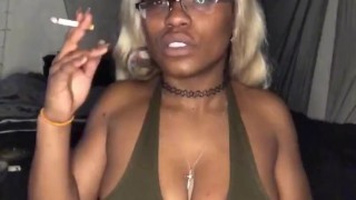 Smoking Milf teases with big tits