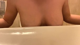 Redhair girl is masturbating wet pussy in public toilet