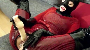 Hot Girl Masturbates In Black Latex Catsuit Mask Gloves Overknee Boots And Pink Fishnet Bodysuit