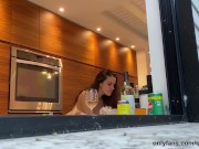 busty brunette Quinn Finite naked in her kitchen