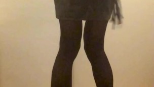 Fuchsia Doll in nylon bodysuit, leather miniskirt, show ass