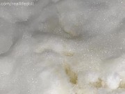 Peeing outside sitting in the snow