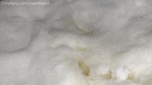Peeing outside sitting in the snow