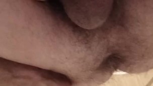 A man pissing on the toilet close-up.