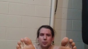 Two Girls torture studs oiled soles with heat gun after he says he's a bad ass and can handle it
