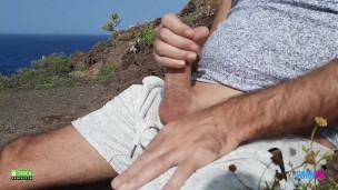 The guy jerks off in front of the sea