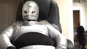 Handcuffed to chair, drooling while gag and cock rub on spandex suit