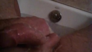 Stroking my cock in the bath