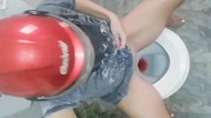 Biker in a red helmet pisses during her period. Tik Tok 