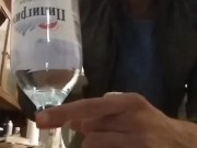 opening a bottle of beer with a bottle of mineral water