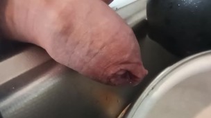 Closeup foreskin pissing on dishes