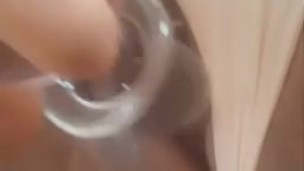 Glass dildo cum close up