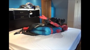 masked guy in orca wetsuit and leather jacket shoots load on spiderman dummy