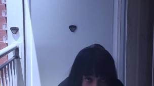 Hari smokes on her balcony