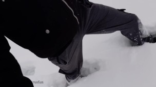 Russian guy walks in the snow near the river, pissing in the snow, he was noticed by a strange guy