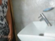Travelling girl without panties washes her dirty feet in bathroom after walking down on the street