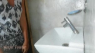 Travelling girl without panties washes her dirty feet in bathroom after walking down on the street