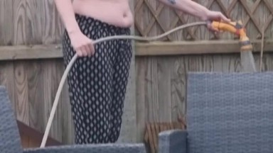 Stepmom watering her garden topless then strips off and joins step son in hot tub naked