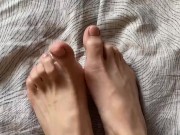 Toes with beige pedicure 7/16