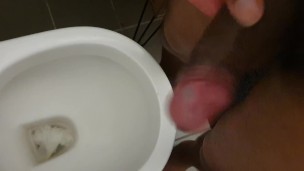 Pissing. Black dick urinal piss and wank