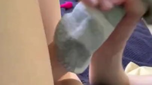 Sock stuffing then rub on dildo