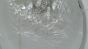 Peeing standing up in a dirty toilet