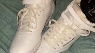 Sexy Slut loves stroking cocks with her sneakers
