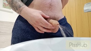 Non-chalant piss in sink