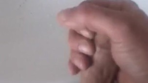Guy jerking in a public toilet