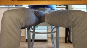 Pissing in jeans under the table