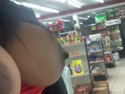 JusAgirl - Slutty Milf showing large boobs in store 