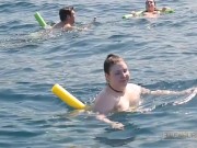 Horny BBW masturbates on boat in front of group 1/16