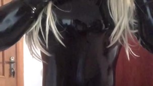 Masked Rubber Doll in Latex Catsuit and Pencil Skirt