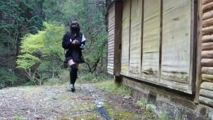 Cute little transgender outdoor exposure services urinating on a mountain