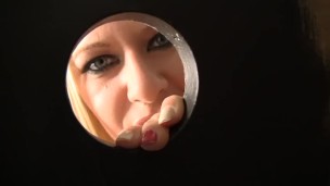 Riley Evans sucks a dick in the gloryhole bathroom