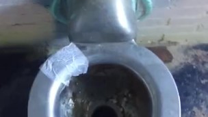 Taking a leak in a nasty outdoor public bathroom 