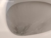 Sitting backwards on the toilet peeing