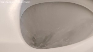 Sitting backwards on the toilet peeing