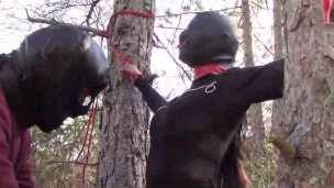 Tied to a tree on a sexy outfit, masked and outdoor deepthroat with no mercy