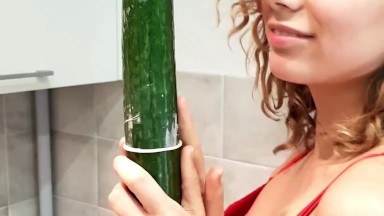 Slim beauty has fun with a HUGE Cucumber