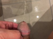Massive urination of a muscular man