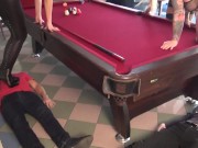 With their high heels and boots, the 3 cruel sadists stand on the slaves while they play billiards 1/16