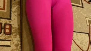 Lesbi in pink leggings makes exercises for abs